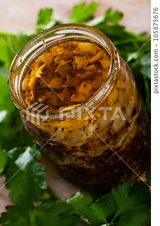 Spicy pickled herring fillets in glass jar Spicy pickled herring fillets in glass jar 105875676