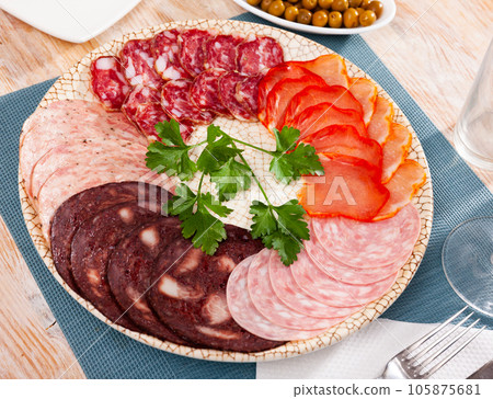 Delicious Spanish antipasto platter with assorted meat Delicious Spanish antipasto platter with assorted meat 105875681