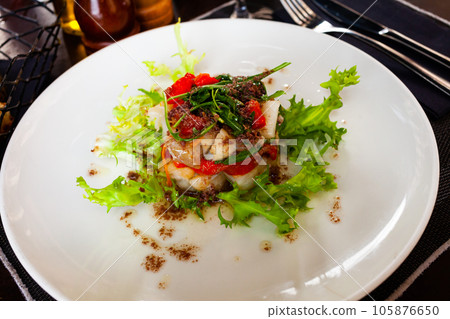 Cod timbale with roasted red peppers, arugula and olives 105876650