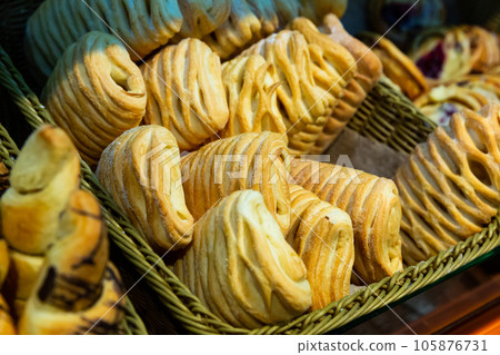 Image of fresh puff cakes at counter in supermarket Image of fresh puff cakes at counter in supermarket 105876731