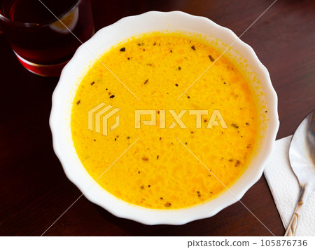 Popular dish of Russian cuisine is cheese soup Popular dish of Russian cuisine is cheese soup 105876736