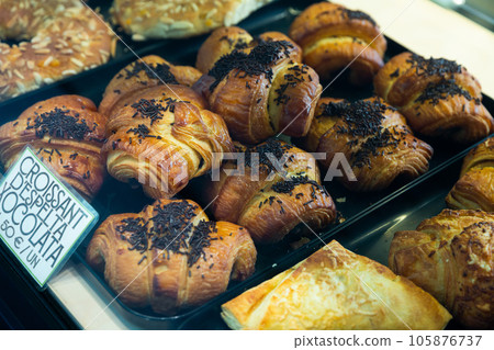 Fresh tasty chocolate croissants on counter, nobody Fresh tasty chocolate croissants on counter, nobody 105876737