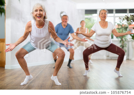 Mature woman with visitor actively moves and learns to dance hip hop Mature woman with visitor actively moves and learns to dance hip hop 105876754