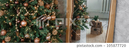 Bronze balls on the Christmas tree close-up. Christmas tree design decorations. The concept of celebrating New Year and Christmas. 105877720