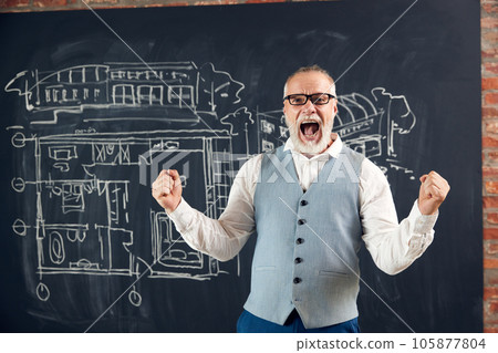 Happy and excited bearded senior man, architect expressing positivity about successful project finish Happy and excited bearded senior man, architect expressing positivity about successful project finish 105877804