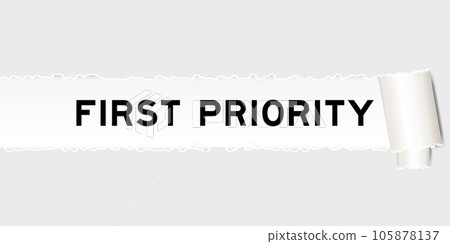 Ripped gray paper background that have word first priority under torn part 105878137