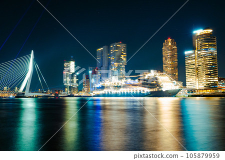 Panoramic view of the night city. Rotterdam city skyline. City towers illuminated panorama 105879959