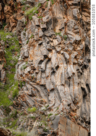 natural stone background texture. Basalt columns, rock formation, unusual mountain topography, geological background natural stone background texture. Basalt columns, rock formation, unusual mountain topography, geological background 105881058