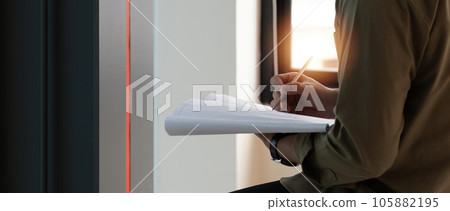 Engineer or Architect working on construction blueprint. Construction concept Engineer or Architect working on construction blueprint. Construction concept 105882195