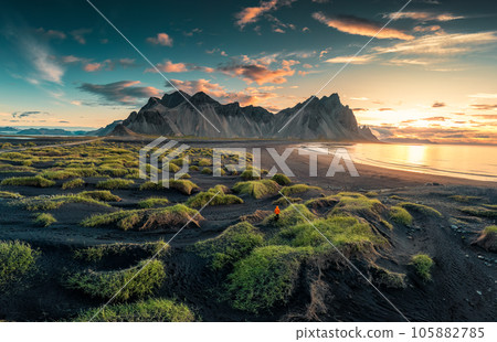 Sunrise over Vestrahorn mountain on black sand beach in Stokksnes peninsula at Iceland Sunrise over Vestrahorn mountain on black sand beach in Stokksnes peninsula at Iceland 105882785