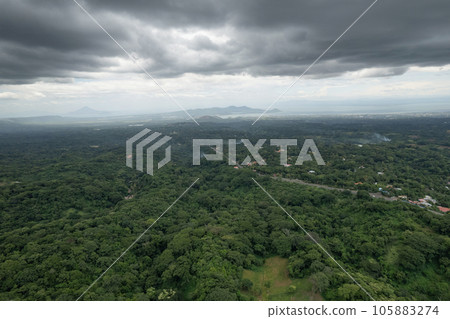 Green valley landscape with lake and volcano Green valley landscape with lake and volcano 105883274