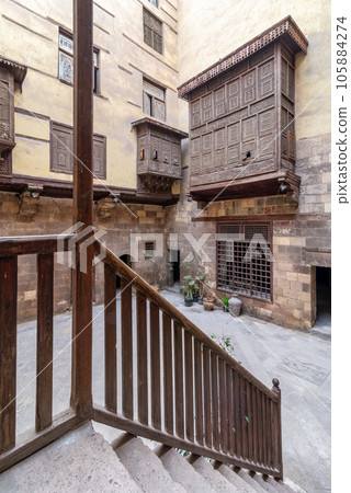 Courtyard of ottoman historic house of Zeinab Khatoun with wooden oriel windows Courtyard of ottoman historic house of Zeinab Khatoun with wooden oriel windows 105884274