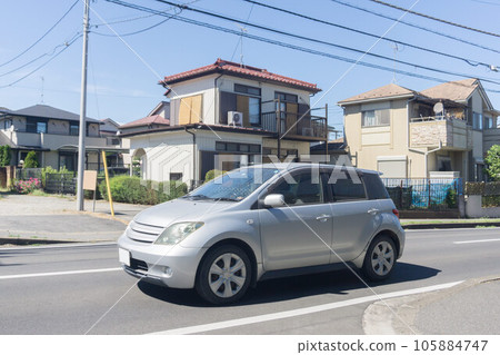 Compact car road driving 105884747