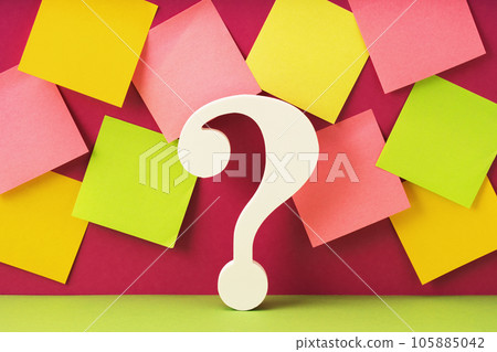White question mark symbol against many mockup notes background. QandA FAQ. Questions and answers. How to and why concept 105885042