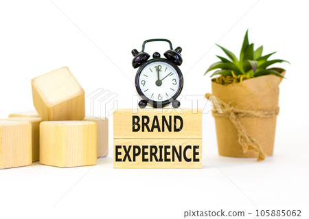 Brand experience symbol. Concept words Brand experience on wooden blocks. Beautiful white table white background. Black alarm clock. Business branding and brand experience concept. Copy space. 105885062
