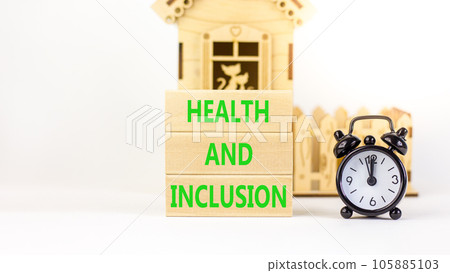Health and inclusion symbol. Concept words Health and inclusion on wooden block. Beautiful white table white background. Black alarm clock. Business motivational health inclusion concept. Copy space. 105885103