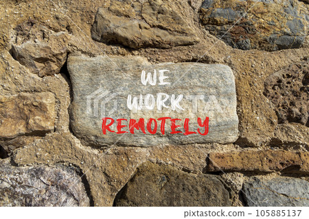 We work remotely symbol. Concept words We work remotely on beautiful big stone on stone wall. Beautiful stone wall background. Business we work remotely remote work concept. Copy space. We work remotely symbol. Concept words We work remotely on beautiful big stone on stone wall. Beautiful stone wall background. Business we work remotely remote work concept. Copy space. 105885137