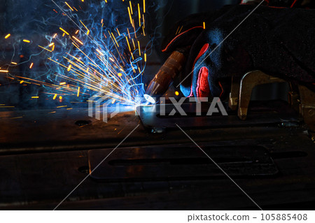 Using semi automatic argon arc welding welder executes professional welding tasks 105885408