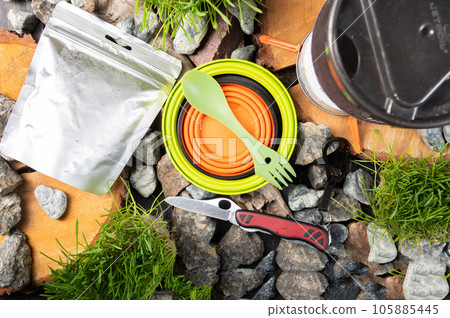 Silicone folding tableware for tourists. Tourist composition of dishes and food. Tourist food and utensils. View from above. 105885445