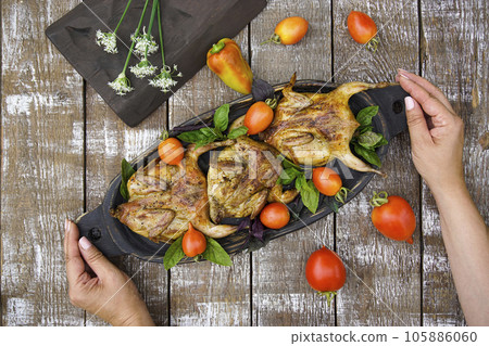 Freshly grilled quail. Fresh vegetables. Food photos. 105886060