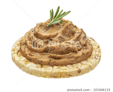 Pate on puffed rice cake isolated on white background Pate on puffed rice cake isolated on white background 105886135