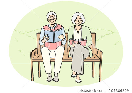 Mature couple on bench reading books Mature couple on bench reading books 105886209