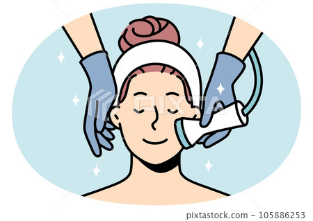 Woman enjoy face care treatment in salon 105886253