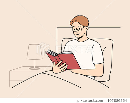 Man reads book before bedtime, sitting in bed at night and enjoying plot of fantasy novel Man reads book before bedtime, sitting in bed at night and enjoying plot of fantasy novel 105886264