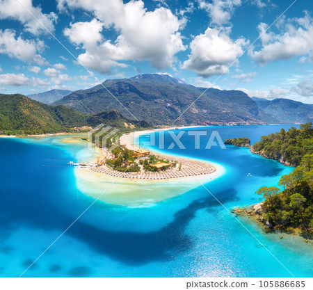 Aerial view of sea bay, sandy beach, green trees, mountain Aerial view of sea bay, sandy beach, green trees, mountain 105886685