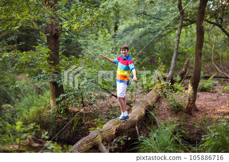 Child hiking in mountains. Kids at river shore. Child hiking in mountains. Kids at river shore. 105886716