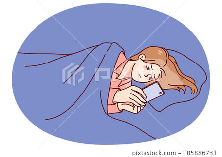 Woman lying in bed at night using cellphone Woman lying in bed at night using cellphone 105886731