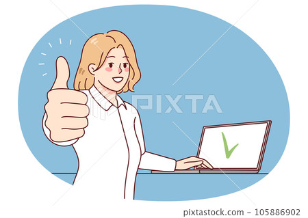 Smiling woman working on laptop showing thumb up 105886902