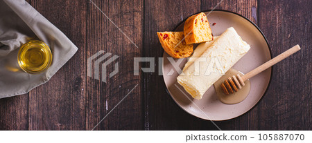 Turkish kaymak clotted cream butter with honey on a plate top view web banner Turkish kaymak clotted cream butter with honey on a plate top view web banner 105887070