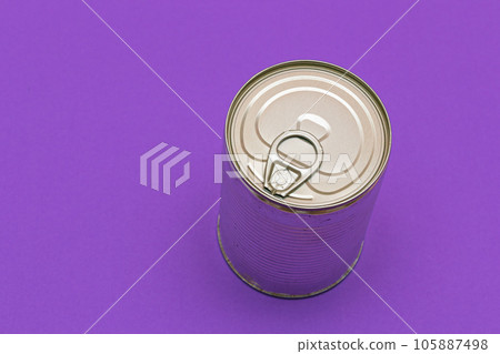 Unopened Tin Can with Blank Edge on Violet Background 105887498