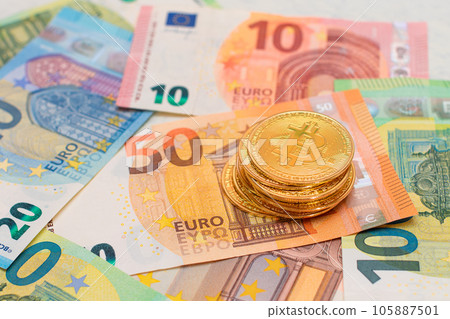 A Stack of Bitcoin Coins on the Euro Banknotes A Stack of Bitcoin Coins on the Euro Banknotes 105887501