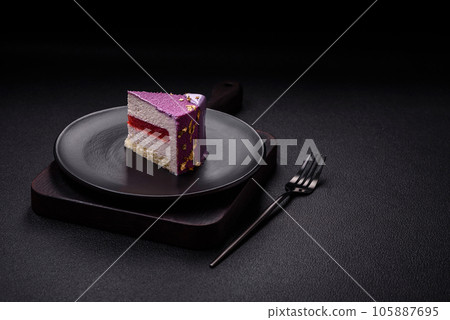 Delicious fresh sweet mousse cake with berry filling 105887695