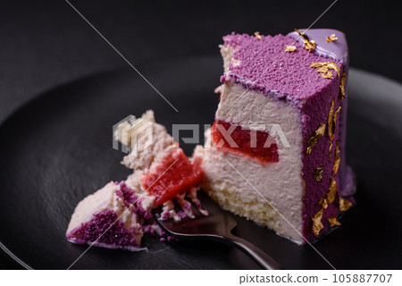 Delicious fresh sweet mousse cake with berry filling Delicious fresh sweet mousse cake with berry filling 105887707