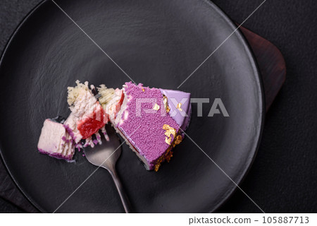 Delicious fresh sweet mousse cake with berry filling Delicious fresh sweet mousse cake with berry filling 105887713