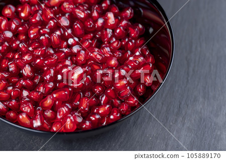 peeled red ripe pomegranate with red sweet grains peeled red ripe pomegranate with red sweet grains 105889170