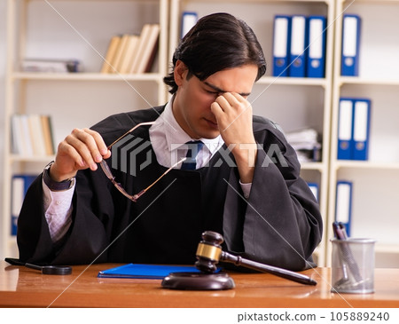 Young handsome judge working in court 105889240