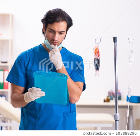 Young male doctor in blood transfusion concept 105889296
