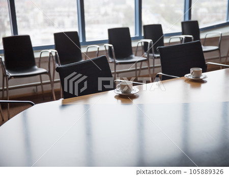 Meeting room with coffee cups Meeting room with coffee cups 105889326