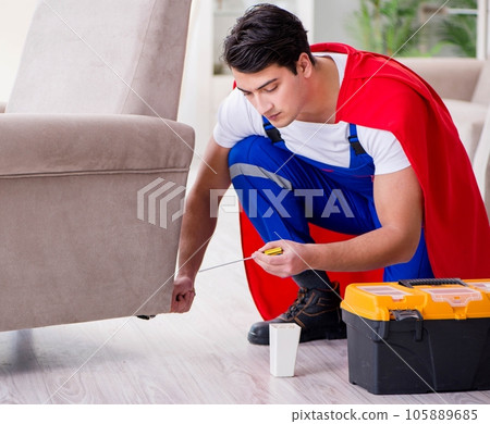Superhero repairman with tools in repair concept 105889685