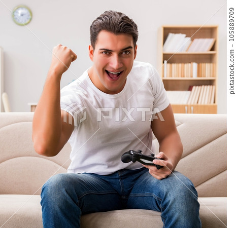 Man addicted to computer games Man addicted to computer games 105889709