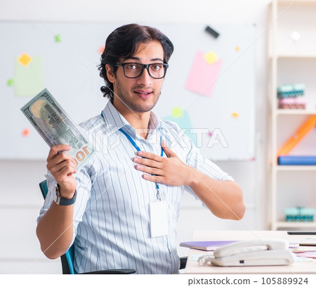 Young handsome male designer working in the office Young handsome male designer working in the office 105889924