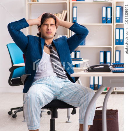 Employee coming to work straight from bed 105889941