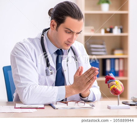 Young male doctor lecturer cardiologist working in the clinic Young male doctor lecturer cardiologist working in the clinic 105889944