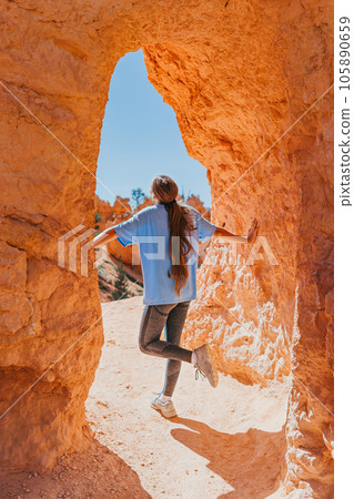 Hiker girl in Bryce Canyon hiking relaxing looking at amazing view during hike on summer travel in Bryce Canyon National Park, Utah, United States. 105890659