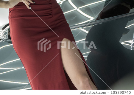 Beautiful legs seen from a dress with a bold slit Beautiful legs seen from a dress with a bold slit 105890740
