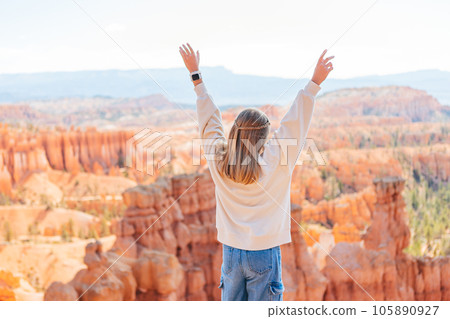 Little girl in Bryce Canyon hiking relaxing looking at amazing view during hike on summer travel in Bryce Canyon National Park, Utah, United States. 105890927